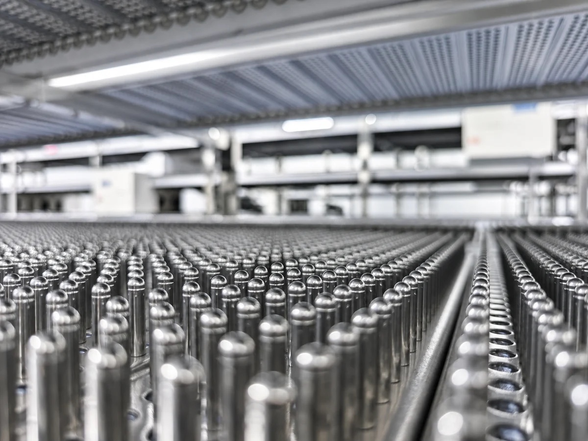 Rows of polished metal forming pins used in empty capsule production at StellarCaps.